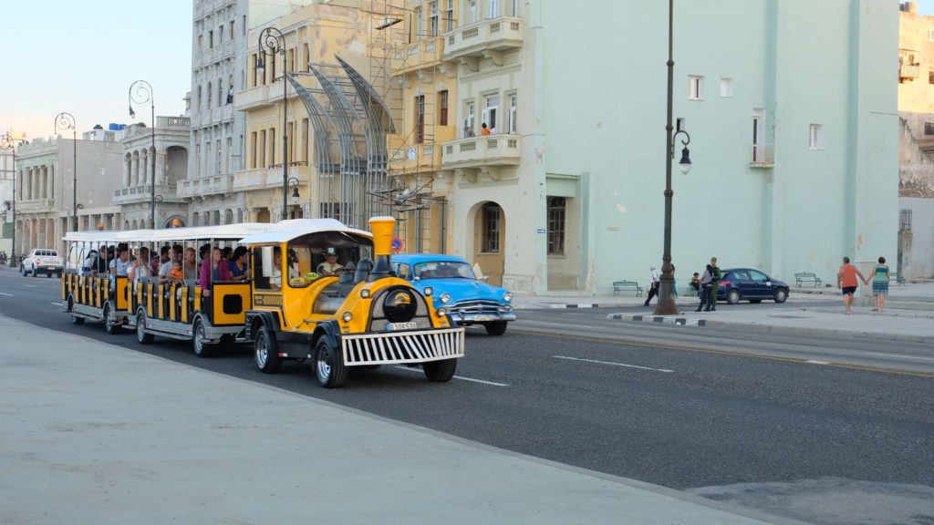 Classic car and colourful buildings on the Malecón in Havana, Cuba