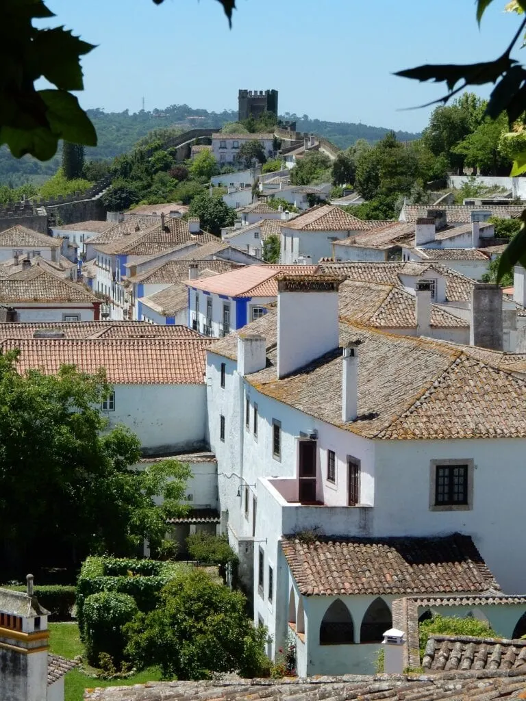Whitewashed street in the medieval town of &Oacute;bidos, Portugal